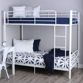A white bunk bed featuring blue and white pillows, designed for a stylish and comfortable bedroom environment.